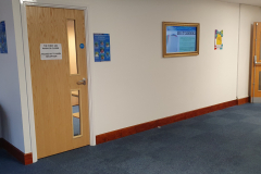 Plasterboard office wall with built-in TV